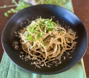 Creamy lemon and arugula spaghetti topped with fresh Eatmore Pea Shoots and grated Parmesan cheese.