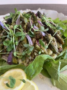 Orzo salad with roasted asparagus, sun-dried tomatoes, red onion, arugula, and Eatmore Pea Shoots.