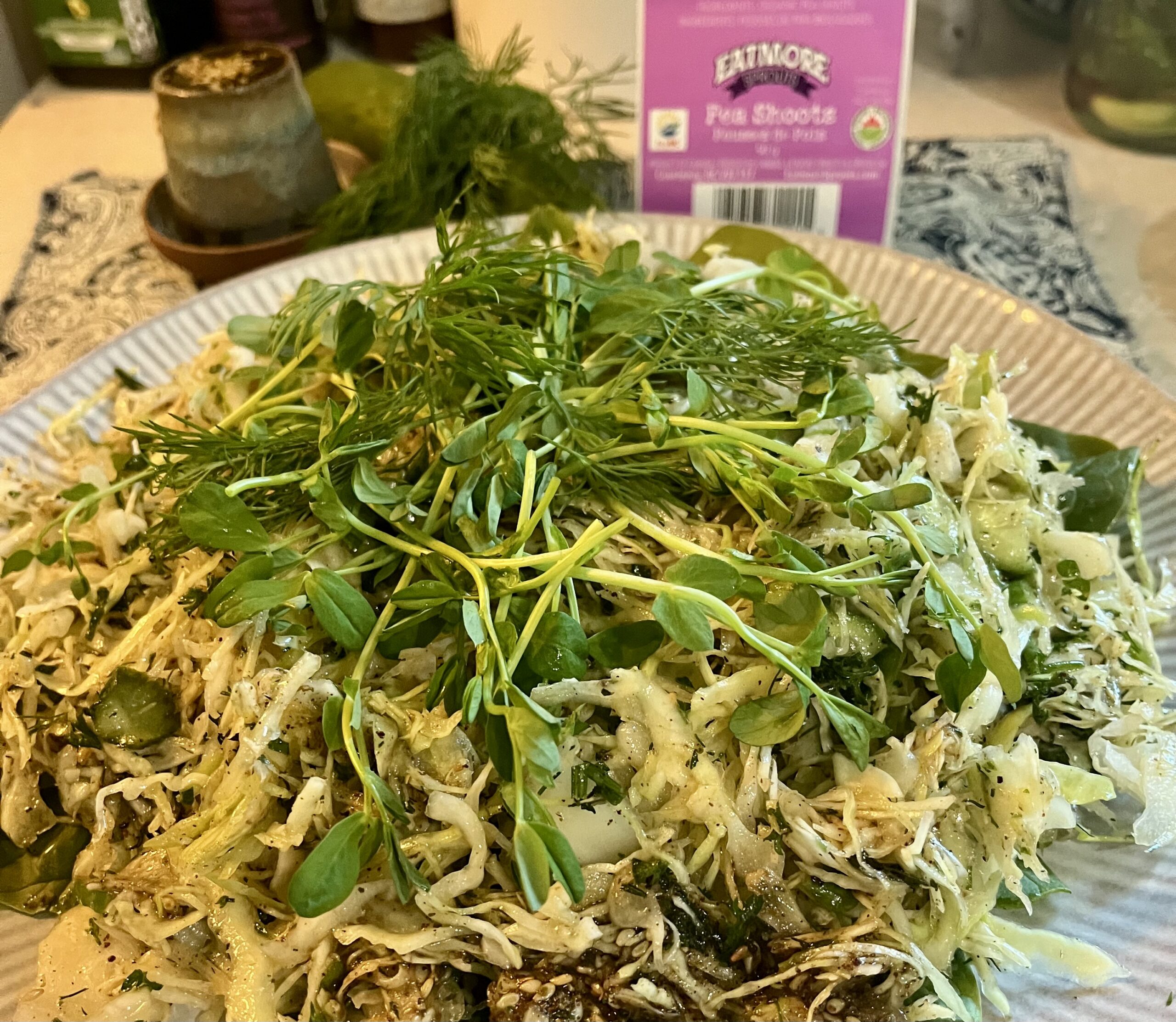 Pea shoot and cabbage salad topped with fresh Eatmore pea shoots and dill.