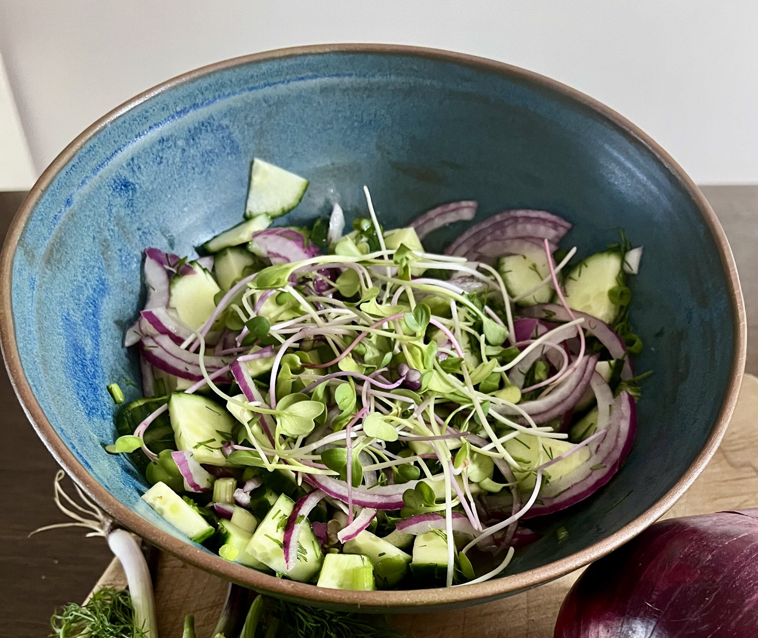 Cucumber salad with red onion, fresh dill and Eatmore Microgreens.